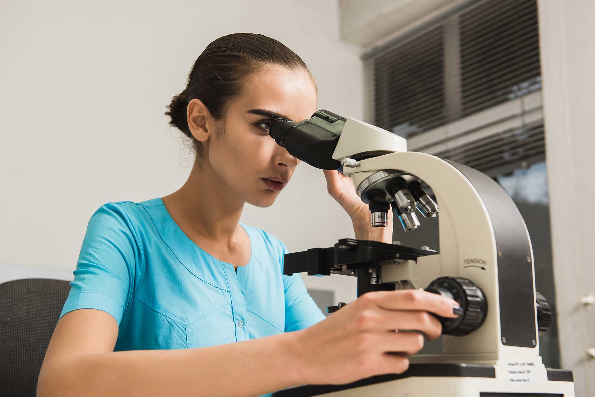 female with microscope